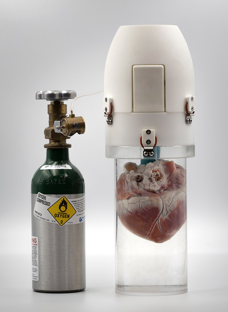 The ULISSES Device from Vascular Perfusion Solutions, with the fluid-filled container and oxygenator head