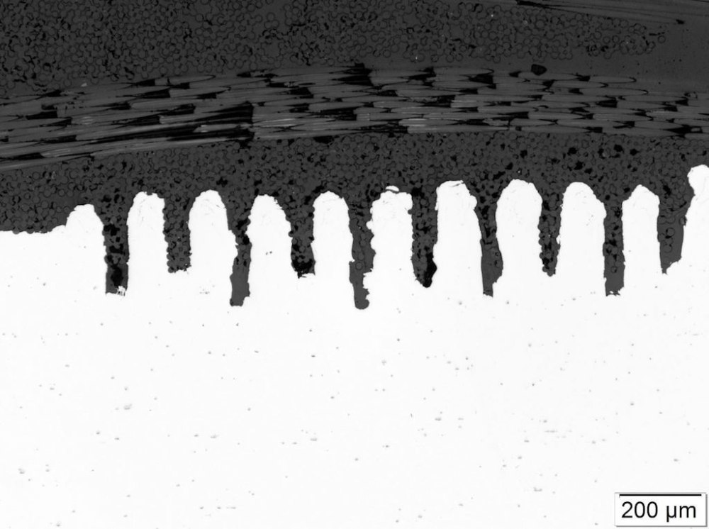 an image of metal after laser ablation, so that plastic more easily bonds to it